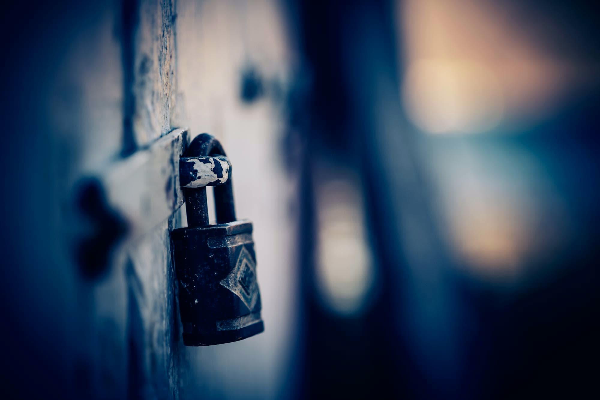 A padlock against dark bokeh